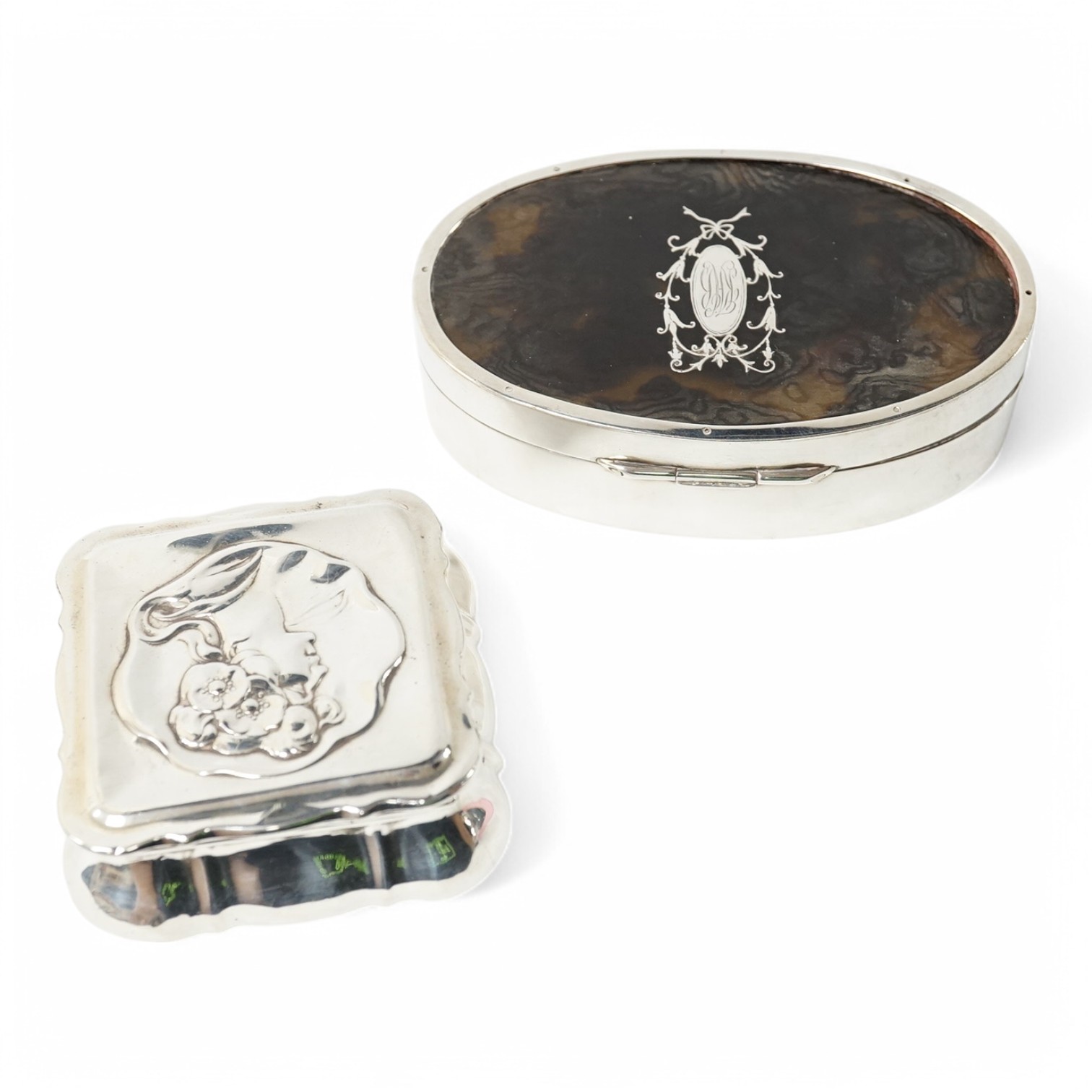 A late Victorian Art Nouveau silver small trinket box, by Horton & Allday?, Birmingham, 1900, 67mm, embossed with the bust of a lady, together with a George V silver and tortoiseshell pique mounted oval trinket box, Levi